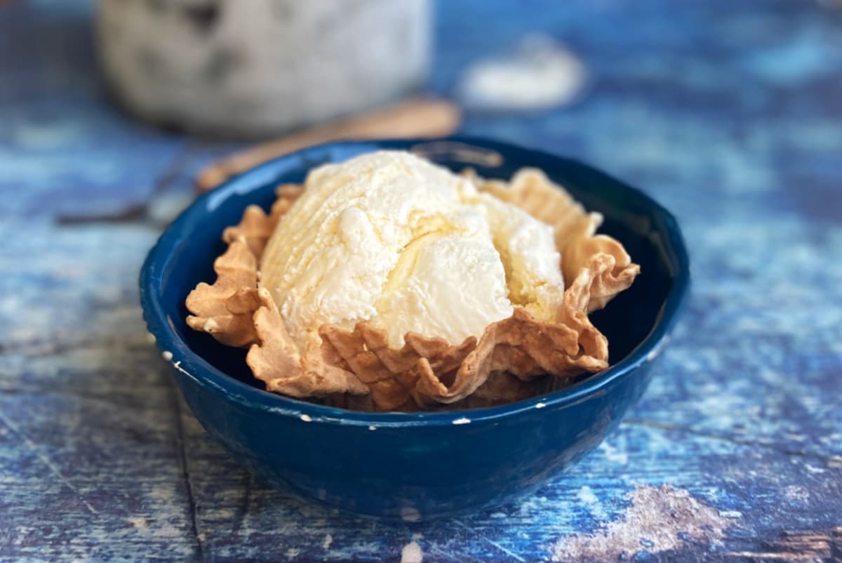 Vanilla ice cream in a waffle cone bowl.