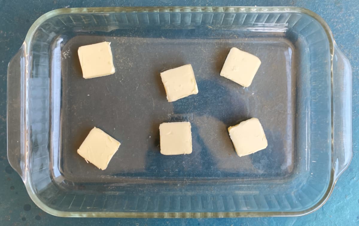 Cubes of butter in a glass baking dish.