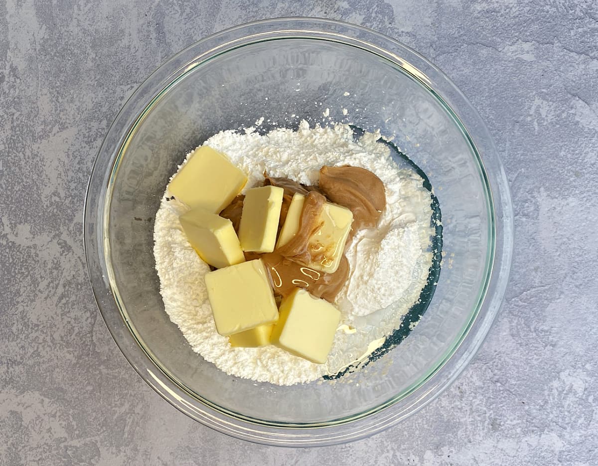 Ingredients for candy centers, unmixed in a medium glass mixing bowl.