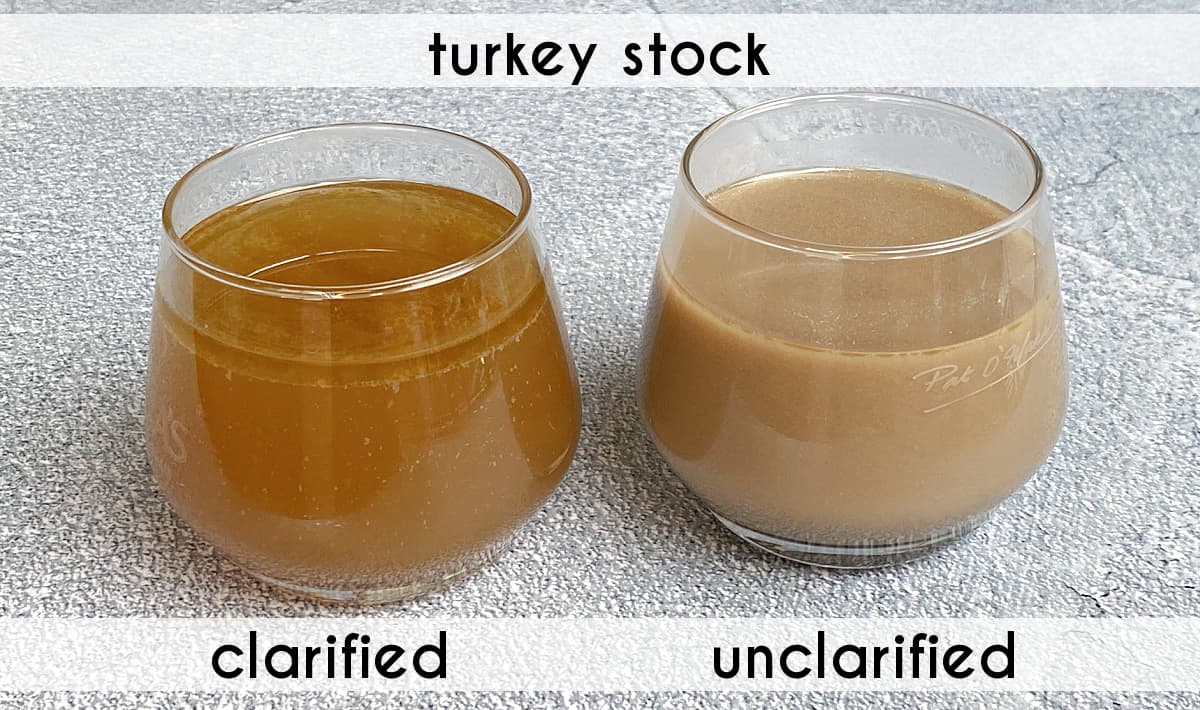 Two glasses of turkey stock, labeled: one clarified (transluscent) and the other unclarified (i.e., cloudy).