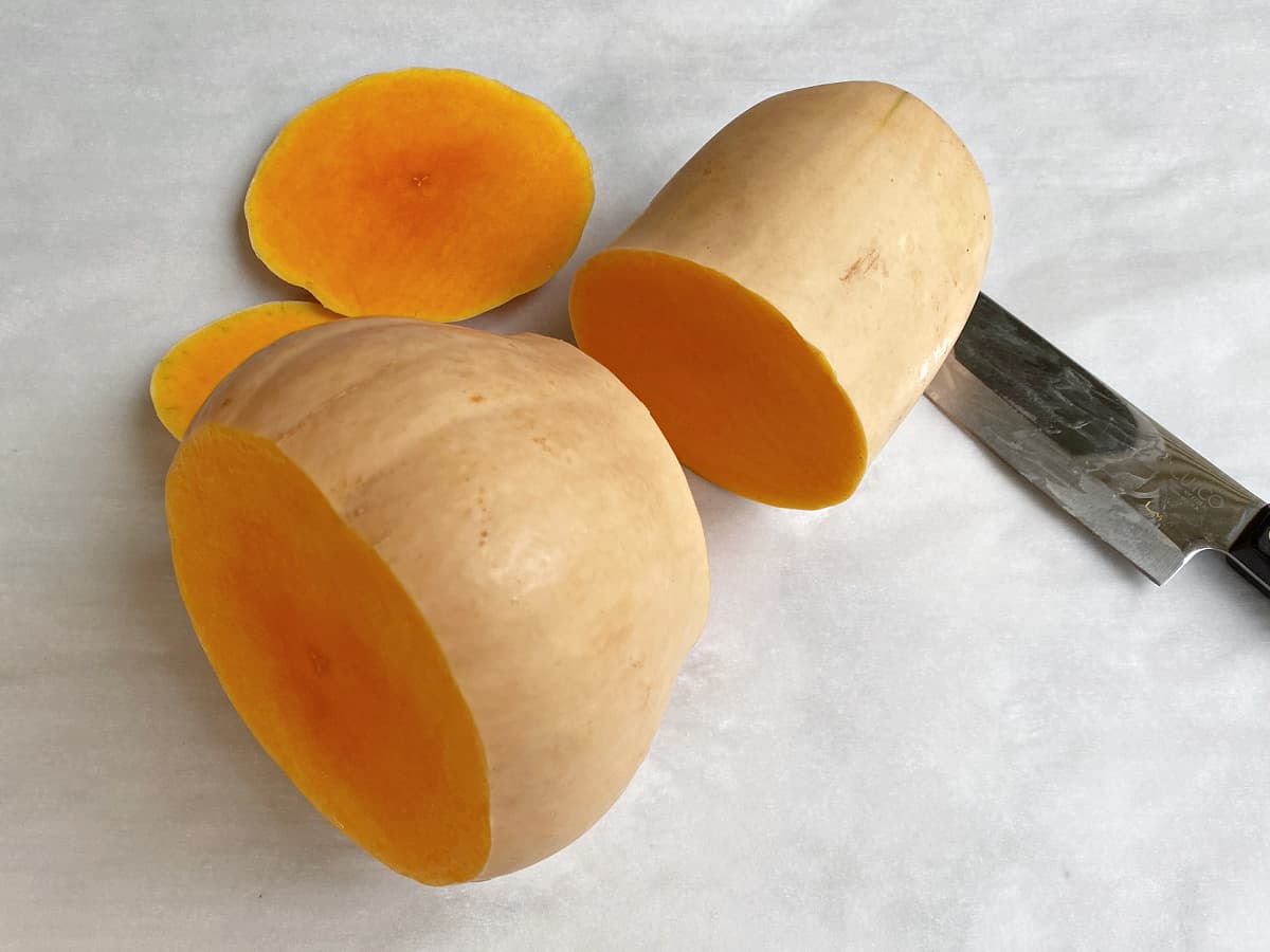 Squash cut in half horizontally where the narrower top meets the wider bottom. 