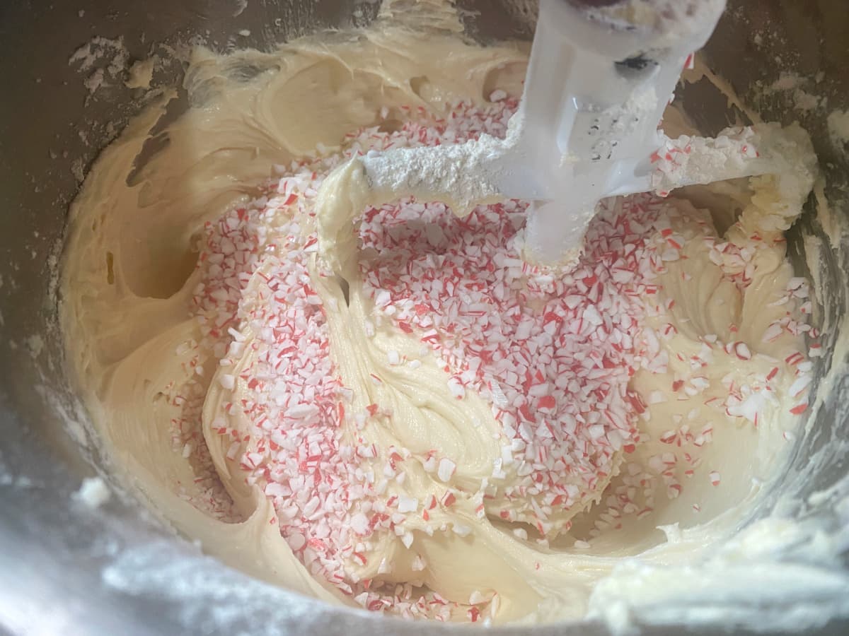 Peppermint sprinkles added to batter in mixing bowl.