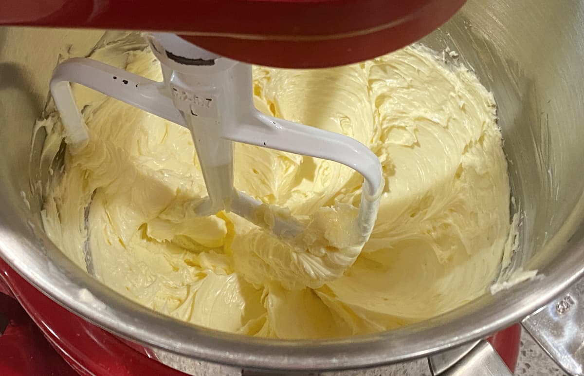 Butter fully creamed, in mixing bowl.