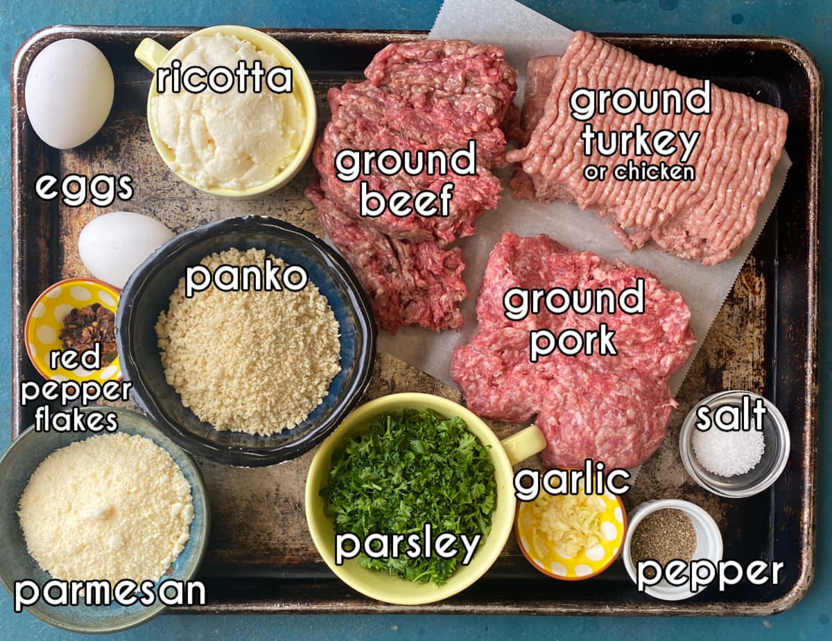 Photo of individual ingredients that go into this baked ricotta meatballs recipe, measured and prepped.