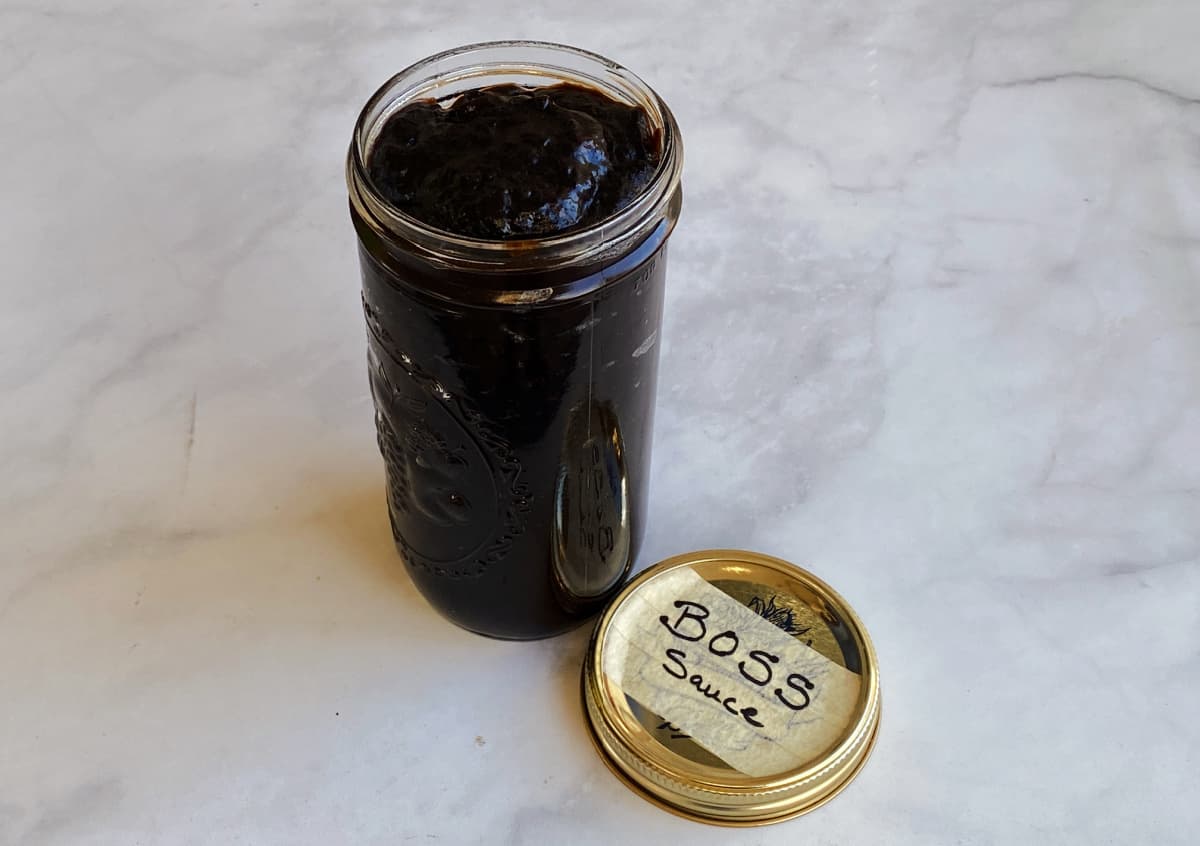 Jar of dark brown sauce, with the lid labeled "Boss Sauce."
