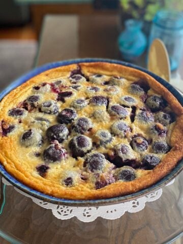 Cherry clafoutis baked in a pie dish, ready to serve.