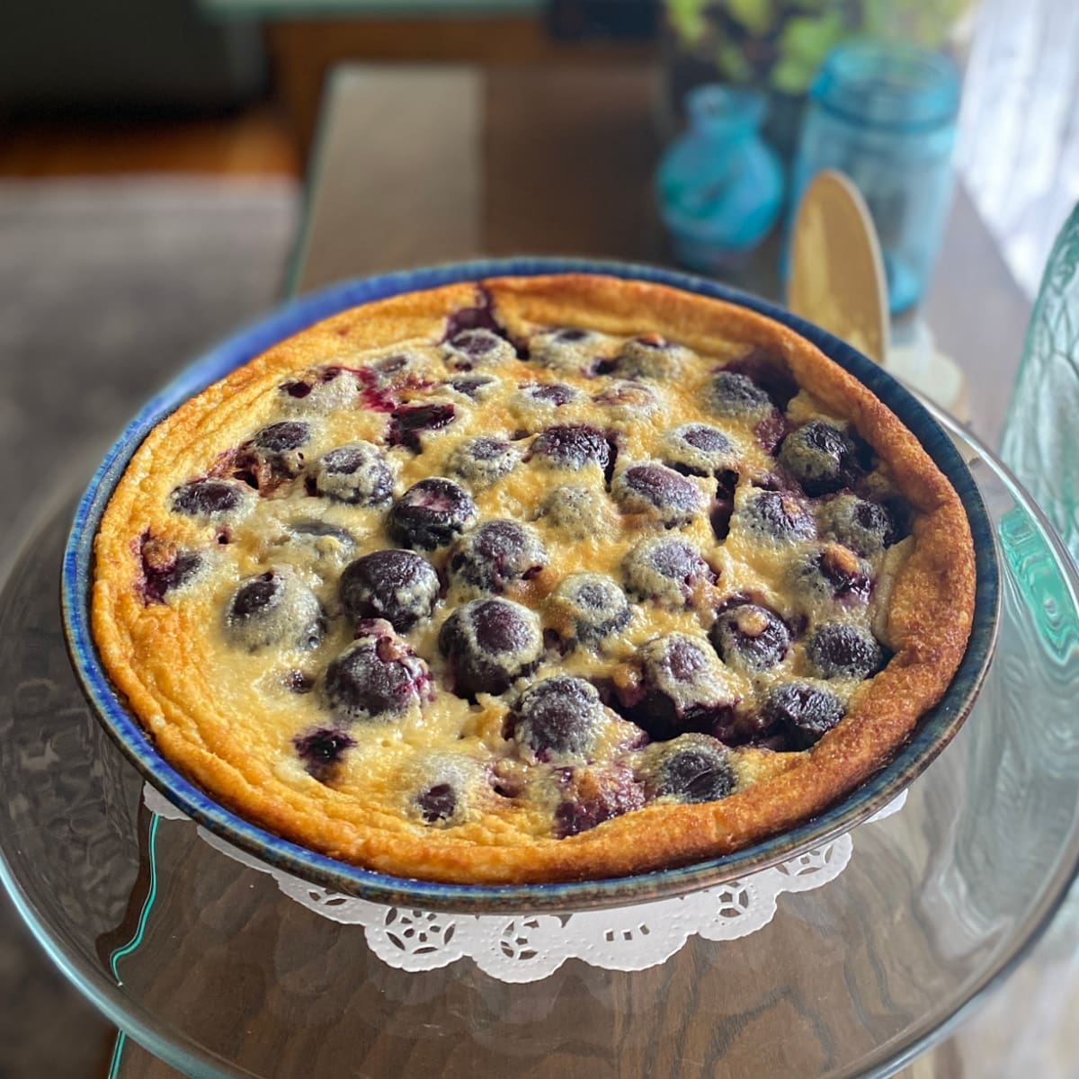 Cherry clafoutis baked in a pie dish, ready to serve.