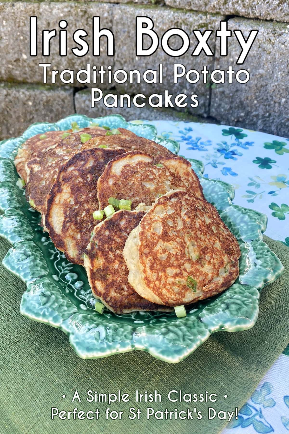 Irish boxty potato pancakes stacked on a plate with crispy golden edges. Pin text overlay reads Irish Boxty, traditional Irish potato pancakes - A simple Irish Classic, perfect for St Patrick's Day. 