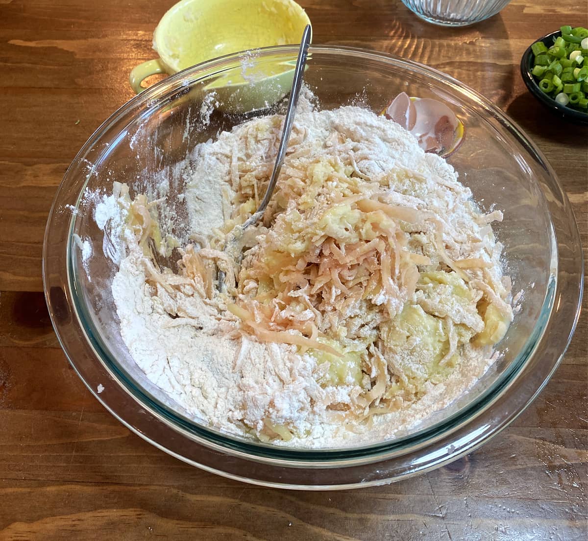 Boxty batter made with mashed and grated potatoes mixed in a bowl.