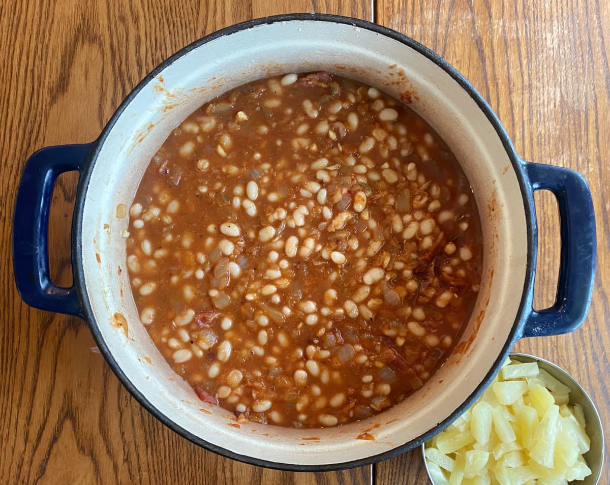 Cooked beans mixed with pineapple sauce before slow baking.